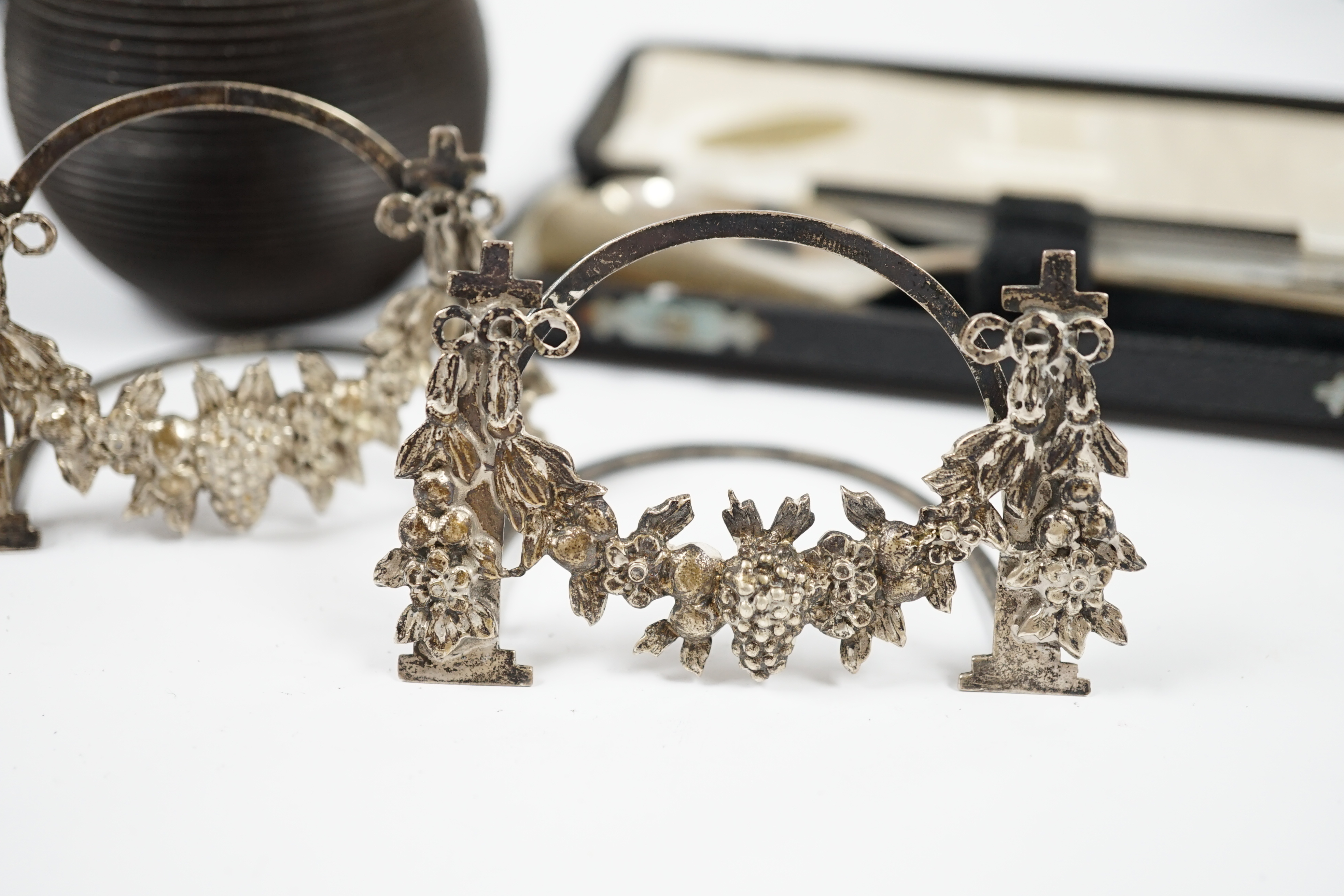 Sundry small silver including a modern mounted wooden match tidy, a George V bracelet, pair of menu holders and cased spoon. Condition - fair
